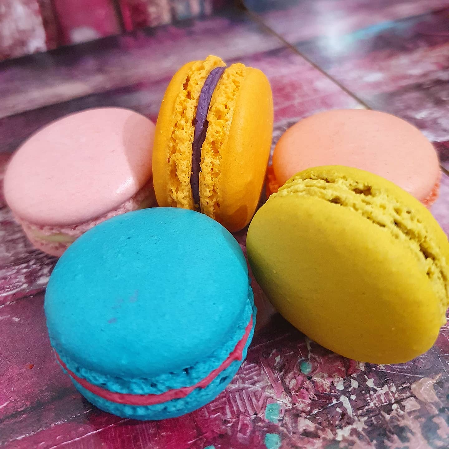 Colorful artisan macarons arranged beautifully